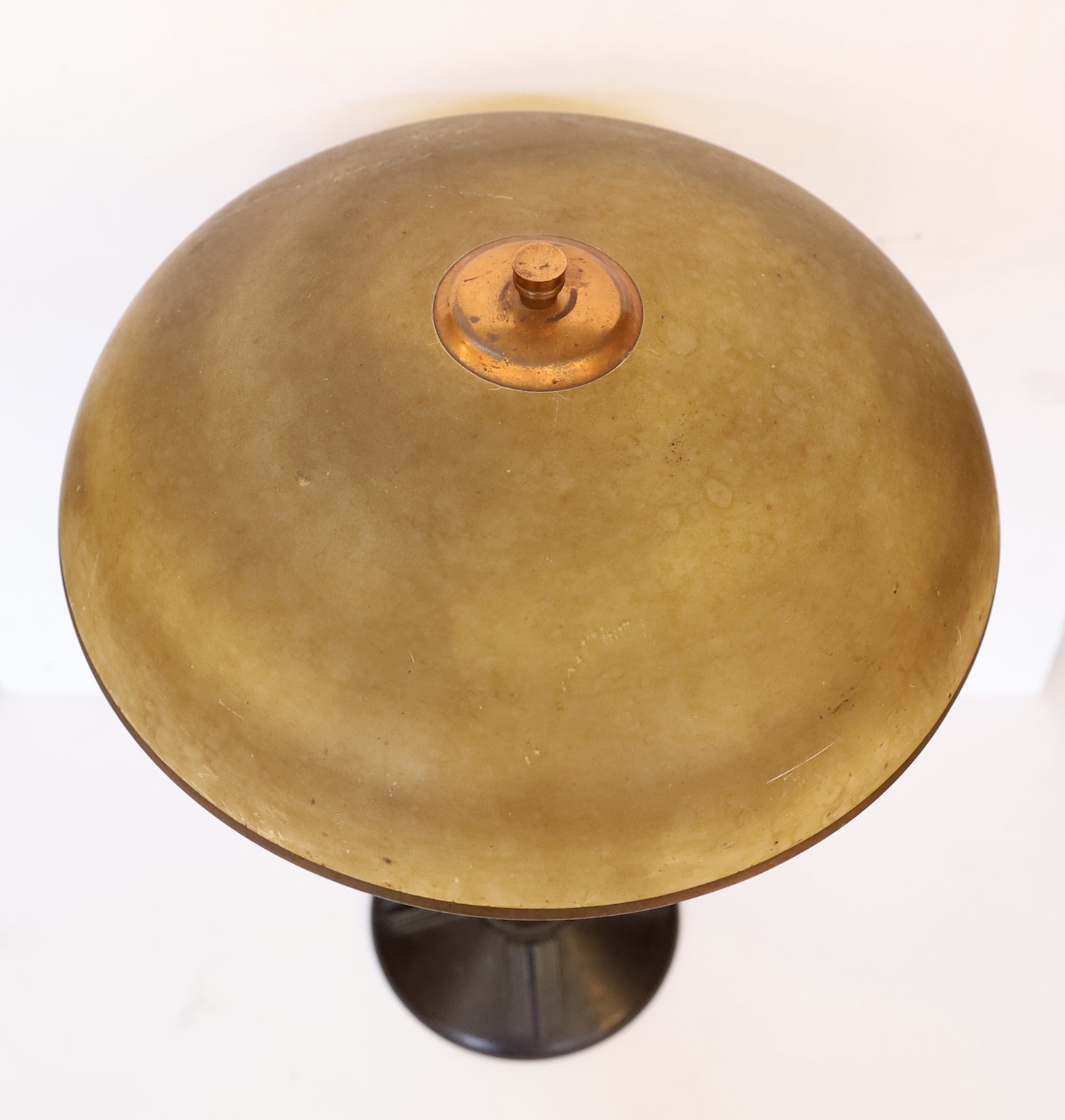 A 1930s French black phenolic and coppered metal table lamp, height 49cm